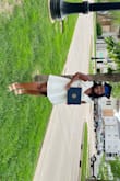 I wore this dress to my college graduation! The material is definitely thicker, so it's a good quality dress. It was a little tight in the chest but I wouldn't have sized up. I'm on the shorter side so you can see how long the dress was on me - Samantha R.