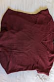 This is an oversized low cut sweater shirt that is made of a slightly thicker fabric than regular t-shirts. It runs large and if you bend down, the opening is large enough to see your bra! I have to pull up the shirt over my shoulders for a more modest fit wearing it to work. Otherwise, it is a beautiful color and I like it for everyday, casual wear. - Kristen S.