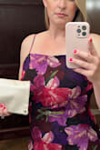 Pretty lightweight dress with adjustable straps. High but not too high leg slit makes walking easy. Super flattering and comfortable! - Emily D.