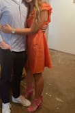 I paired this dress with hot pink heels for a rehearsal dinner and received so many compliments!!! I'm obsessed with the orange and the sleeves were so puffy and didn't flatten. It was a little difficult to get the wrinkles out but other than that 10/10. - Courtney B.