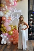 I wore this for my bridal shower and it absolutely perfect!! I got a size medium. It was a little long, but I'm also short. It was so beautiful, and fit perfectly! 100/10 would recommend! - Briana P.