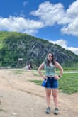 I ordered this shirt based on the model in the photo where it looked like a normal tank top. Surprise! It's a crop top! I was skeptical at first (the sleeves are a little long) but it really makes for good cleavage and overall I felt very confident wearing it on a hike. Highly recommend. - Valeria B.