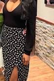 Great material and has a lot of stretch. The chest area is a very deep cut so I would wear tape if wearing without a bra. Overall happy with this bodysuit! - Jasmine C.