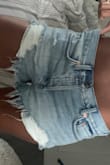 Was super excited for these because they are so cute HOWEVER, they fit a little awkward. My FreePeople jeans are a 25 so I thought a 25 in the shorts would be perfect but sadly they are not. Once I tried to shrink them in hot water and dry them on high it was a tiny bit better. I don't know if it's because of the buttons that make me look like I have a ***** lol but the waist is also a tad loose. I recommend maybe getting one size smaller. - Jennifer D.