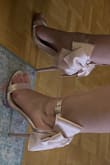 The fabric feels beautiful on these shoes, and I love the ribbons on the back for that added cute yet sexy vibe. - Ashley M.
