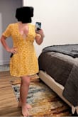 Slightly tight in the back making it difficult to zip. Very low cut so I will be adding a stitch or two. Light and flowy fabric. Comes up above my knee and fits my short frame well. - Dana P.