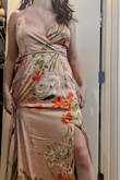 This is a very luxurious dress that actually has a surprising amount of fabric in the skirt/bottom. My leg did not show through the slit unless I was very intentionally posing, simply because of how much thick fabric the dress has (it really is a lot!) This is not a casual maxi. Overall, I think I may actually order this in a darker color for a special occasion. I ended up returning this dress because the blush pink floral is nearly the exact same color as my skin (fair). It just... Blends into me. I think I expected like a "blush" or "peach" flowery hue, but depending on the lighting it's more mauve-ish or light beige in color. It also didn't flatter my bust area that well... so overall... not what I expected. - Arynn P.