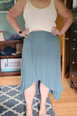 I love this skirt! Material is not flexible but fits fine, sits high waist and the skirt flows beautifully when you walk. Back is long, which works great for a tall person. I've paired with the Lulus sweater tank I got and they look great together! - Kira W.