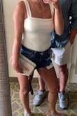 I wear an XS in everything else I have from Lulus, but had to exchange this one for an S, and could probably wear an M if I were to order another color. I'm only 5'3 and wish it was a little longer so I didn't have to hear a "stretching" sound every time I put it on. Other than the sizing, I absolutely love it, and the material is not see-through with it being white. It washes well in the washing machine. Once it is on, it is fairly comfortable. Easy to be dressed up or down, and has become a staple piece in my closet! - Katie C.