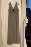 The colour of the dress is more sage green in natural light. The dress is gorgeous but unfortunately the bust runs small/tight if larger chested. Nevertheless, a nicely made gorgeous dress perfect for a summer wedding! - Megan V.