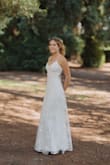 I absolutely loved this dress. I bought it as a prom dress but everyone said I looked like a bride. I brought in the waist area slightly because the back had a gap that did not fit my waist. I could have bought a smaller size but I was nervous it would be too small in the chest area. The dress worked great and felt like great quality, dirt did not show up much from touching the floor. - Mairin I.