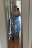 The dress is super pretty! The fabric is really great and the slit hits the perfect spot. Runs long for short girls, you'd probably need a hem. If you're in between sizes I would size down :)  

I was looking for a bridesmaid dress so I ended up returning for a different style the bride liked better. - Shannon H.