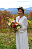 I purchased this for my outdoor November wedding. It fit perfect minus the length, but I am on the shorter side. I got it hemmed for my height but otherwise great fit. I was also almost four months pregnant and was able to hide the bump nicely! - Mary C.