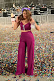 I love the color! Gives me Selena vibes :) I didn't realize the slits go ALLLL the way to the top of the leg and it was a windy day so I had to be mindful not to accidentally flash people LOL but other than that it's such a cute outfit!

The pants are long (I'm 5'8"), but the tailor said it would've looked weird if the pants were any shorter. Not a big deal though. Especially if you wear with heels. - Adriana M.