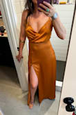 It turned out really lovely and perfect for the wedding I went to. I usually wear an xs in Lulus dresses and it was nice and snug around my rib cage. But I had to get it altered, I took several inches off the length, made the slit about 10" higher, and took in the sides, below the waste seam, because there was just too much unnecessary material there. There wasn't much I could do with the bust and my seamstress didn't want to get into it so I left that as-is, but it was very loose for my smallish chest, I used fashion tape so my tits wouldn't pop out, worked like a charm. Did notice it's starting to pill on the back after one wear. Other than that the material was nice and silky feeling and the burnt orange color was what I was looking for. - Sophia M.