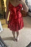 The vibe I got from the stock photo was sexy glam. In there, it looks like parts of the dress are darker which adds some dimension to the dress. In real life it's pretty much all intensely red sequins. It felt like a flashback to my show choir days. Additionally, the sequin band eels a couple of inches too low, so that it isn't highlighting the most narrow part of the waist. It's not a bad looking costume, but not really the vibe I was going for. - Katie B.