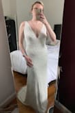 After trying on wedding dresses at bridal shops I never thought I'd find a dress that matched me. It's so comfortable and doesn't feel overproduced like a normal wedding gown- the beading is gorgeous and super flattering. Originally ordered XL thinking it'd be better but the chest was super loose and extra-low so I exchanged it for L and it was perfect- not too tight on my hips and I don't think it'll need any tailoring. I do wish it had a bustle built in though. - Casey J.