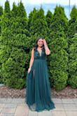 I loved this dress! I think the lace on the bodice pulled the dress together. People were complimenting the dress all night, especially the double slits that would show when I walked. I also loved how the back had adjustable straps. It was super comfortable, I wore it for like 10 hours. The color was true to the picture. It looks long in the picture because I didn't have time to have it hemmed before the event. I didn't need to wear a bra so I just wore stickies underneath and it was perfect. - Bich-Tam N.