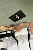 The artificial leather material is really cheap-looking and will likely flake after some use during the summer, but they're very versatile sandals and are cute enough on the foot. Sizing was good as well. - Milly C.