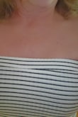 This dress is super cute but not for larger busted women. I bought the small and it fit everywhere except bust. Returned for medium and it fit in the bust but too large in hip area. Also the medium had a strange smell (small did not) and a weird top sew-picture below. It might be hard to see in picture but left side did not match to right side. - Lisa R.