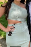 I loved this dressed it was so flattering. It did not ride up and I am a curvy gal. It fit perfectly.  I ordered a large and loved it. Even with the cut out it did not fee too revealing because you were covered everywhere else - Nicole A.