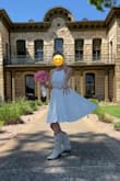 Well, I love this dress. You can dress it up, or dress it down. And great for twirling!!
The fabric is sturdy (not flimsy) and a bit on the heavy side&perfect for a windy day. You won't have to hold it in place! It's fully lined and hugs you in all the right places (but if you need to tweak it, the straps are adjustable). Originally ordered a Large, but a bit too loose so replaced it with a Medium & perfectly snug while allowing comfortable breathing. The waistline hits right at the bottom of the rib cage. Paired mine with a belt. The dress is knee-length so feel free to twirl without showing too much! I recommend pairing it with boots&tried booties but the smaller shoes had a ho-hum effect.
As you can see, this was my wedding dress, and it was perfect for my spring outdoor wedding! Was cool and comfortable and felt like the belle of the ball. - Harper M.