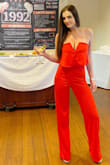 Absolutely love it! I ordered a medium I'm pretty tall and it ran long. I didn't need to have it hemmed though I just wore a heel. Got lots of compliments! Comfortable- it didn't fall all night like some strapless items do. It has boning to hold it in place. - Kristen K.