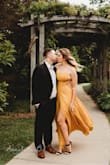 I wore this dress for engagement photos and it is beautiful! The color is vibrant and the dress is great quality. As much as I loved it, it's not the best dress for people with large busts. You definitely get lots of side boob as you can see with the pic. - Sarah D.