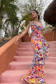 This dress is divine! It fits so well. Very comfortable. A little loose in some spots but I wouldn't have gotten a size smaller. Very comfortable. It flows beautifully and just touch the ground with some high heels. I did not wear a bra and it provided perfect coverage. I can't wait to wear it again. - Danielle B.