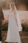 I love this dress and it was perfect for my small rustic wedding! I had to order in multiple sizes because it runs a little large, but it is so beautiful! I usually wear a small but the extra small fit perfect (length wise, both sizes were long and I needed minor hemming) I really wasn't sure how I felt about it when I ordered it, but was pleasantly surprised by how much I loved it! It is very low cut in the chest so I added a little fabric to give it more of a conservative feel, and also added a Lulus beaded belt to give it a little sparkle. I loved everything about this dress and it photographed beautifully in all my wedding pictures! - Michelle D.
