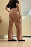 The pants are exactly as pictured. The fabric is light and airy, but feels and looks high quality. I love the blush color - as pictured on model (my photos look a little yellow). It's definitely high waisted, but not uncomfortable in any way. Deep front pockets. The pants might be a little long for someone short, but I am able to wear flats or heels. Definitely would recommend. - Tori R.