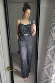 I love this jumpsuit. I'm curvy with a small waist and wide hips and this is a perfect cut for that. I wish the top were tighter and will likely have it taken in. My girls are saggy after baby so absolutely needed a strapless bra. I added a belt for waist definition and a little something. Wore for a Bach party. Got tons of compliments. - Casey S.