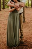 I chose the sage green for our engagement photos. It is such a pretty, neutral color in person and photographs so well! I loved the back detail and the slit. It fits true to size and I would recommend a sticky bra or going braless. The straps did slide down at times but no biggie since i only wore it for photos. - Megan D.