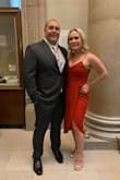 I received so many compliments on this dress. It is definitely more of a rust red than a cherry red. It is flowy, comfortable and fit like a glove. The straps are adjustable which is extremely helpful if you do not want to wear a bra. I wore a regular strapless bra and it worked out perfectly. - Nikki W.