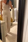 I'm always hesitant to buy a romper because I feel like it always accentuates my lower belly after having a child. Regardless I went for it and I'm going to try this for my bridal shower outfit. I purchased it in a small size which is my usual size, I'm 5 foot three so with heels it will work but without heels, I would need to hem shorter just a bit.  It's a very light material but thick enough to feel good quality. I don't know that I would wear it somewhere where you going to sweat if it might stick to you. Looks like it will be easy to wear without a bra if you are small-chested. - Melissa M.