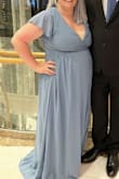 I had ordered an XL but it was just way too loose in the shoulder and the bust area. The XL was also too big around the waist. After I sized down everything fit great except the bust was tight exposing the gals a bit more than I would have liked to. The dress is gorgeous though! I'm going to have it altered for my height. - Jacey C.