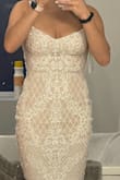 I bought this dress for my wedding reception in Mexico. It was perfect. It hugs your body in all the right places but isn't too tight. The bust wasn't as fitted as expected. It still fit very well. I recommend a sticky bra with it. By the end of the night, the sequins rubbed against my underarm. It was sore. But the dress looked so good it was worth it. It was very high quality compared to a lot of other dresses I bought from other websites. - Nicole V.