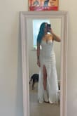 Well, you will feel sexy on this dress for sure. It's pretty and fits well. I loved it on me besides the chest area being waaaay to tight and producing some back rolls. This is a dress for a bride looking to feel like a James Bond movie character. If you have <32C breasts I would recommend a M, unless your upper body has no fat. - Sarah F.