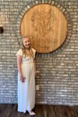 I wore this for my bridal shower and got so many compliments on it! I did have to get it hemmed and get the shoulders taken in to make it tighter but I loved the way it turned out. I already want to wear it again! - Sarah B.