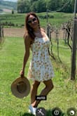 I bought this dress for the summer. Very cute. I bought a M but it was tight in the bust area. And the zipper didn't go up all the way. 
I wore it to a winery with white sneakers and a hot I also got from Lulus. 
Btw the L fit perfectly. - Bianny L.
