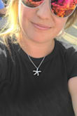 Very comfortable - I bought a Medium even though typically I wear a large to give it more of a crop top look.  It's still comfy!  Material is very stretchy and can be dressed up or down. - Kira W.