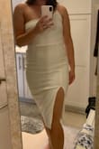 This dress was really nice, and exactly as pictured. I'm usually a medium or large and went with the large. It ended up being even a little tight still, definitely more of a body-con fit. The fabric was also a little see-through for the white color and felt like it may fall down a bit without some help. Still very pretty and would look great if sized up! - Abbey M.