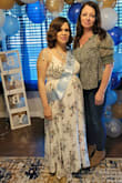 This dress was perfect for my babyshower. I was 31 weeks pregnant so I order one size bigger(M) since I got the dress a month 1/2 in advance. It was really comfortable around my belly area and I didn't need to use a bra which was perfect. I loved the flow of the skirt and it was just the right length so no alterations needed. Some people in other reviews complain about the heaviness of the skirt but it was not not an issue for me. I liked the extra fabric on the bottom because it made the dress not see-through and more flowy. - Arsenia P.