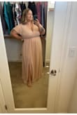 I received so many compliments on the dress and I absolutely loved how it fit. I ordered in two sizes but ended up keeping the larger size because the bust was a little more comfortable. If you are a smaller bust, definitely go a size down! Also, I have pretty short legs (I wear a short inseam) and this dress is LONG! If you're comfortable in heels, you should be fine but I wore 1.25inch and they weren't quite tall enough.  

For reference, I typically wear a size 2 from torrid comfortably, and my jeans are usually 18! - Corynn H.