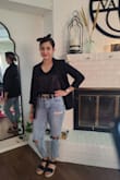 Perfect black top that you can dress up or down. It's a bit shiny and small but I would definitely recommend it. Also bought it in white. Definitely, a closet must-have! - Brandi H.