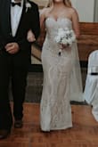 I love this dress overall very much! It's simple but beautiful. The quality is great for the price. I am typically a medium/large in dress sizes, but this ran small and I exchanged it for an extra large and had it tailored to me. I would recommend sizing up and if anything, having it altered to fit you just right. Update: here is a picture of me wearing this dress at my wedding! It was stunning and I received a ton of compliments. I would definitely recommend it. - Natalie J.