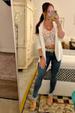 I have this top in 3 colors. 1 is a small (black) and the other 2 are a medium (yellow and this floral) because the small was a *bit* too small. Idk if I'm going crazy but I could swear that the yellow medium fits a little more snug? I do know however that patterns vs solids will sometimes need to be printed on different fabrics in order not to be see through etc so maybe that's the issue here? I also just prefer my tops more fitted and I'm super picky. I probably should have exchanged for a small but I wanted to wear it that night. Still love it regardless!! These jeans are also from Lulus. Big time Lulus fan over here. - Francesca E.