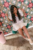Such a pretty dress makes you look like a doll. It is a good length and pattern. - Gabriela W.
