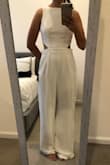 This white jumpsuit is great! I'm 5'4", 127ish pounds, usually a medium (8 or 10), and I ordered the medium. I was debating the small but glad I went with the medium even though I did need to get it hemmed in the length and taken in a little in the waist and bodice (see before/after photos). I felt very chic and received compliments on it. I can't wait to wear it again, I love it! - Meera N.