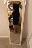 It's tight, but not in a bad-looking way. The fabric is thick and feels high quality. I really like this dress! - Jessica H.